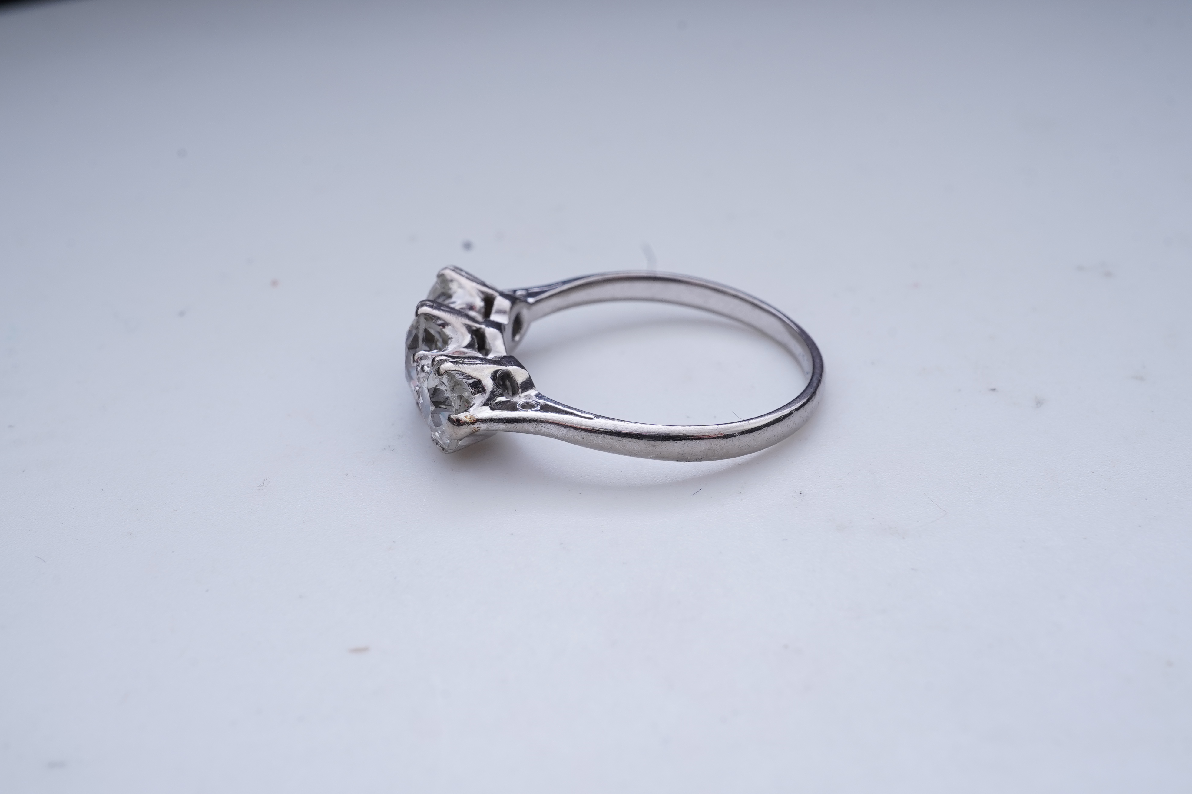A three-stone diamond ring, early 20th century
